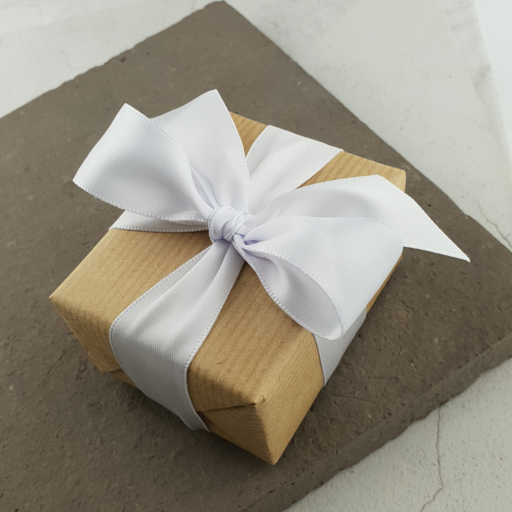 white ribbon gift wrapping